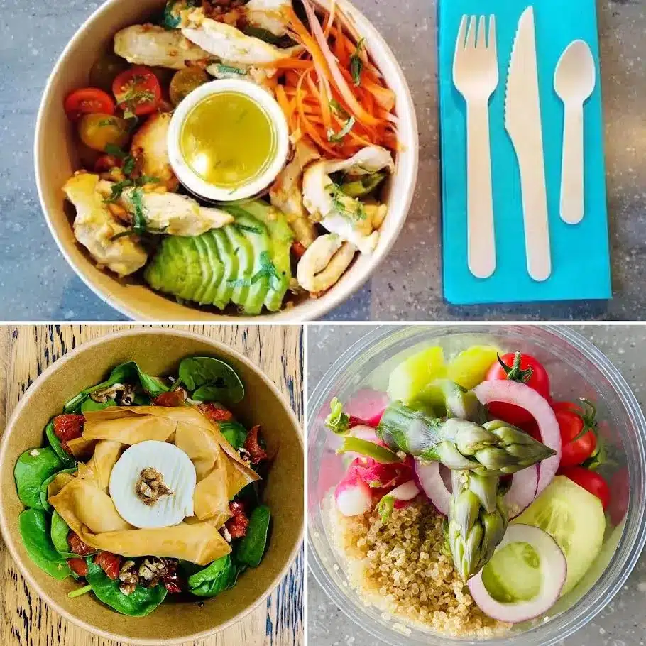 Sélection de bowls healthy avec poulet, avocat, quinoa et légumes frais, servis avec des couverts en bois écologiques.